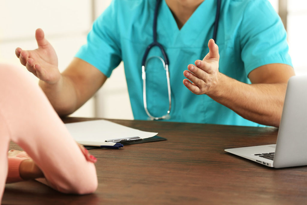 a doctor explaining admissions to treatment common questions