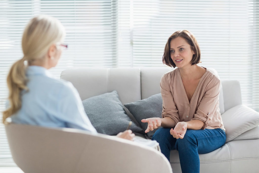 a woman talking to her doctor about counseling for women