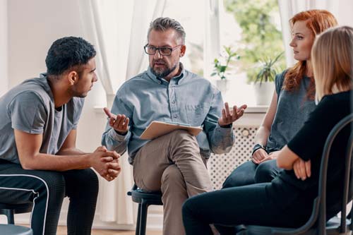 man explaining detox programs in louisiana to a group