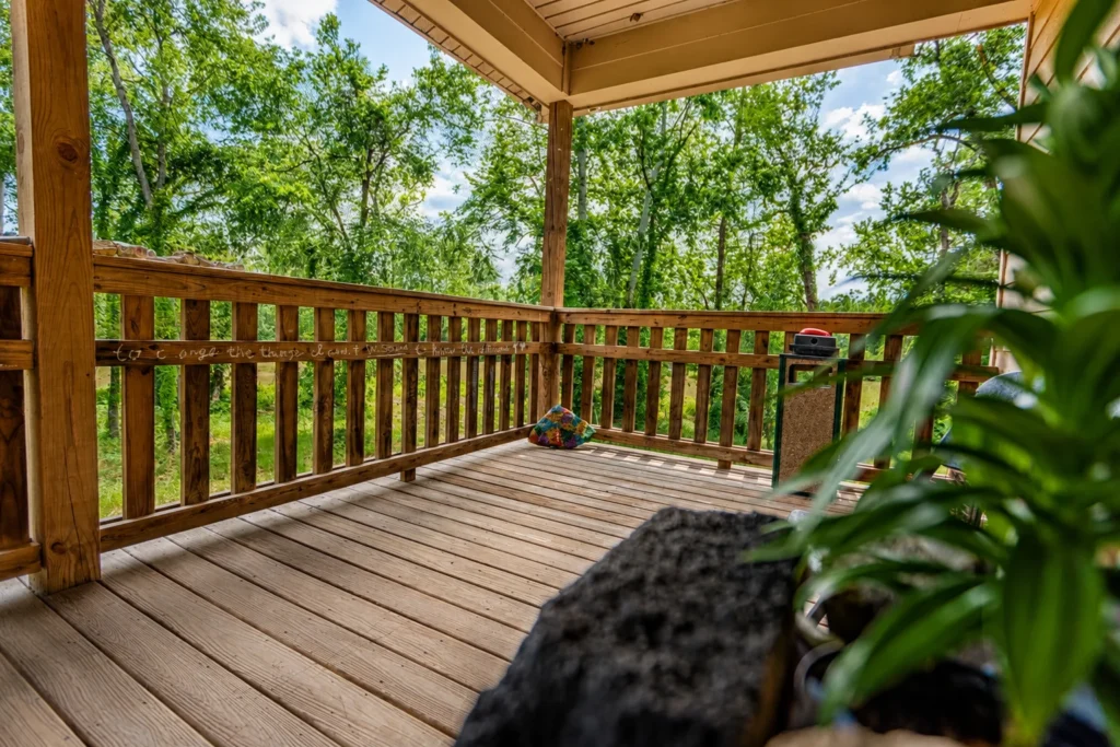 Covered porch or deck in a wooded area